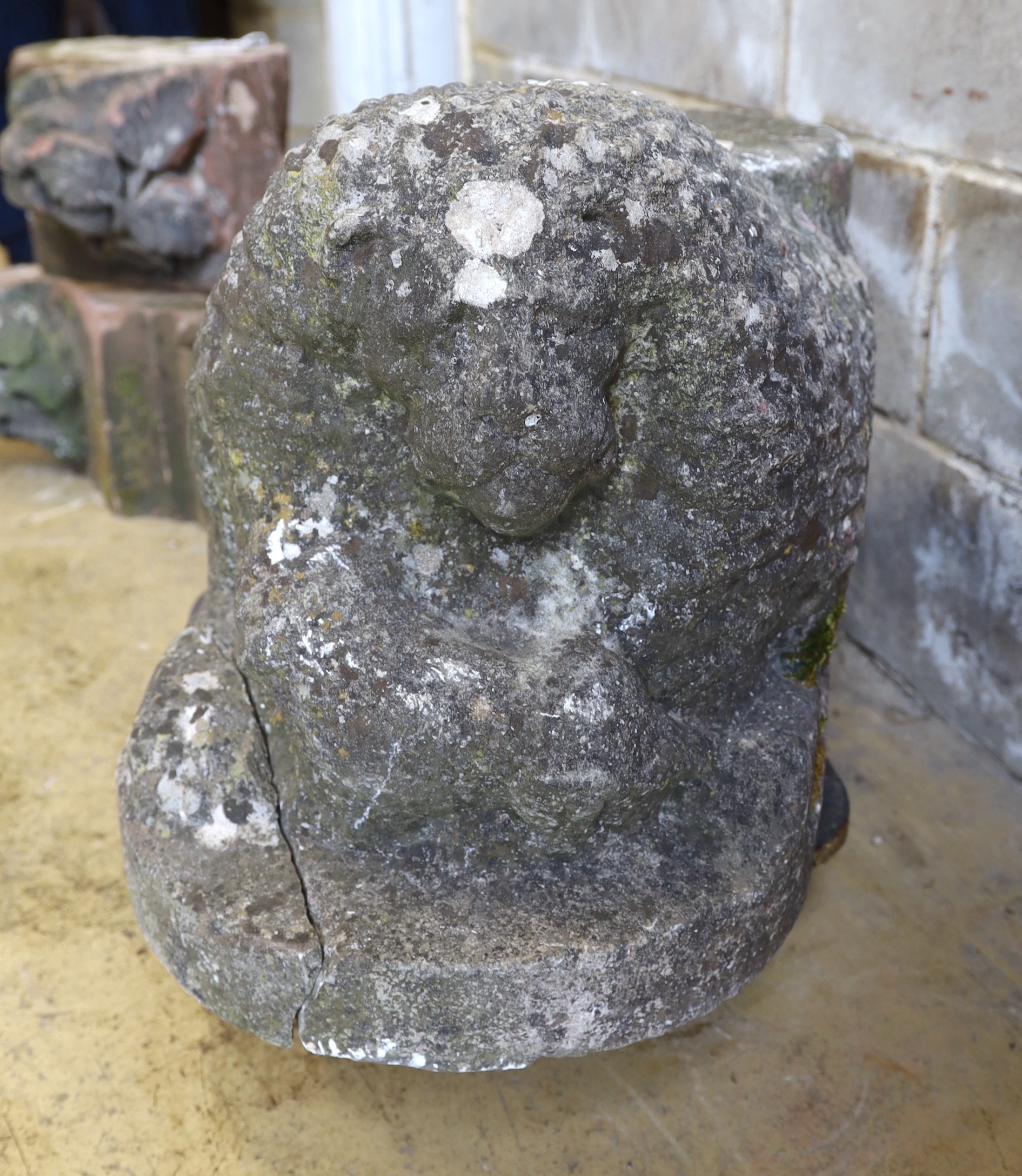 A carved stone lion, length 84cm, depth 40cm, height 45cm